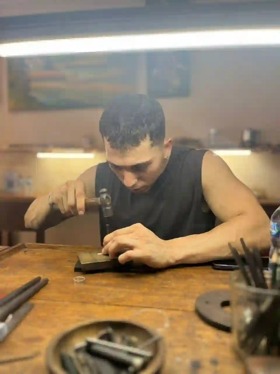 Students crafting jewelry in Sidemen silver jewelry class